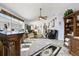 Open-concept living space featuring a full bar, comfortable seating and tile floors at 1917 Peachtree Ave, The Villages, FL 32162