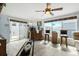 This living room features a full bar, large windows for natural light, and tile floors at 1917 Peachtree Ave, The Villages, FL 32162