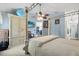 This main bedroom has a four-poster bed, decorative fan, and ample closet space at 1917 Peachtree Ave, The Villages, FL 32162