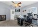 Bright office space features neutral colors, and a ceiling fan at 1917 Peachtree Ave, The Villages, FL 32162