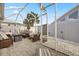 Screened-in patio with brick pavers, stylish outdoor furniture, and a fire pit for relaxing evenings at 1917 Peachtree Ave, The Villages, FL 32162