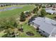 A high angle view of the property that backs onto a golf course and water feature at 1992 Hagood Loop, The Villages, FL 32162