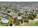 Aerial view of property in a neighborhood with lush surroundings close to the golf course at 1992 Hagood Loop, The Villages, FL 32162