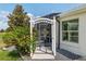 Landscaped backyard featuring screen enclosed lanai with golf course view at 1992 Hagood Loop, The Villages, FL 32162