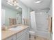 Well-lit bathroom featuring a vanity, toilet, and shower/tub combo at 1992 Hagood Loop, The Villages, FL 32162