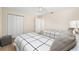 Bedroom showcasing two twin beds and ample closet space at 1992 Hagood Loop, The Villages, FL 32162