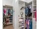 Walk-in closet with custom shelving provides ample storage for clothing, shoes and accessories at 1992 Hagood Loop, The Villages, FL 32162