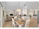 Bright dining area connected to the living room, kitchen, and outdoor patio at 1992 Hagood Loop, The Villages, FL 32162