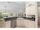 Modern kitchen with updated appliances and convenient access to the dining area and living room at 1992 Hagood Loop, The Villages, FL 32162
