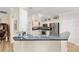 Well-equipped kitchen featuring sleek countertops and modern appliances at 1992 Hagood Loop, The Villages, FL 32162