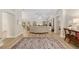 Spacious living room with wood floors, neutral walls, and views of the backyard at 1992 Hagood Loop, The Villages, FL 32162