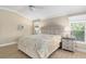 Comfortable bedroom with a neutral palette, ceiling fan, and natural light at 1992 Hagood Loop, The Villages, FL 32162