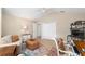 Comfortable office featuring an oversized ottoman and neutral color palette at 1992 Hagood Loop, The Villages, FL 32162