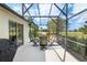 Covered patio featuring outdoor dining area and view of the golf course at 1992 Hagood Loop, The Villages, FL 32162