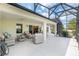 The extended patio has ample space for relaxing or entertaining guests at 1992 Hagood Loop, The Villages, FL 32162