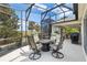 Covered patio featuring outdoor dining area and view of the golf course at 1992 Hagood Loop, The Villages, FL 32162