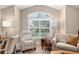 Cozy sitting area with large window and comfortable seating at 1992 Hagood Loop, The Villages, FL 32162