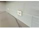Close up of light tile backsplash and marble countertop featuring modern design elements, and electrical outlets at 2261 Osprey Ave, Orlando, FL 32814