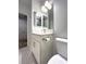 Bathroom vanity with marble countertop, gray tile and faucet at 2261 Osprey Ave, Orlando, FL 32814