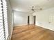 Spacious bedroom with wood floors, ceiling fan, and modern lighting at 2261 Osprey Ave, Orlando, FL 32814