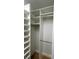 Walk-in closet with custom shelving providing organized storage solutions at 2261 Osprey Ave, Orlando, FL 32814