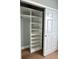 Walk-in closet with custom shelving and a hanging rod for storage and organization at 2261 Osprey Ave, Orlando, FL 32814