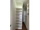Large walk-in closet with custom shelving and drawers providing ample storage space at 2261 Osprey Ave, Orlando, FL 32814