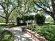 Beautiful community park featuring lush greenery, brick walkways, mature trees, and park benches at 2261 Osprey Ave, Orlando, FL 32814