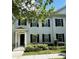 Charming two-story townhome with black shutters, manicured landscaping, and inviting front entrance at 2261 Osprey Ave, Orlando, FL 32814