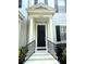 Inviting front door with stately columns and well-maintained landscaping. Address 2261 clearly visible at 2261 Osprey Ave, Orlando, FL 32814