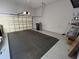 A clean, spacious garage with storage shelves, and an automatic door opener at 2261 Osprey Ave, Orlando, FL 32814