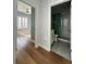 Hallway view showcasing hardwood floors leading to the bathroom and bedroom at 2261 Osprey Ave, Orlando, FL 32814