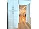 Bright hallway view with wooden floors and white cabinets and trim at 2261 Osprey Ave, Orlando, FL 32814
