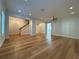 Open-concept living room featuring hardwood floors, recessed lighting, and neutral color palette at 2261 Osprey Ave, Orlando, FL 32814