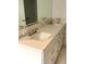 Bathroom vanity featuring double sinks, a quartz countertop, and brushed gold fixtures at 2261 Osprey Ave, Orlando, FL 32814