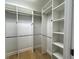 Organized walk-in closet with shelving and hanging rods at 2261 Osprey Ave, Orlando, FL 32814