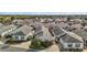 An aerial view of a residential community featuring well-maintained homes and lush green landscaping at 2471 Yalaha Ave, The Villages, FL 32162