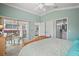 Relaxing bedroom with access to the patio and an attached bathroom at 2471 Yalaha Ave, The Villages, FL 32162