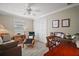 Bedroom featuring a ceiling fan, window with blinds, and a closet for storage at 2471 Yalaha Ave, The Villages, FL 32162