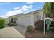Charming single-story home with a well-manicured front yard, attached garage, and inviting curb appeal at 2471 Yalaha Ave, The Villages, FL 32162
