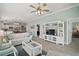 Spacious living room showcasing the kitchen in an open layout at 2471 Yalaha Ave, The Villages, FL 32162
