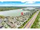 Aerial view of neighborhood and lake with a red pin identifying the property location at 251 Blue Cypress Dr, Groveland, FL 34736