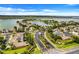 Aerial view of neighborhood with a lake, fountain and lush landscaping at 251 Blue Cypress Dr, Groveland, FL 34736