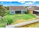 Aerial view of backyard featuring screened in lanai and waterfront view at 251 Blue Cypress Dr, Groveland, FL 34736