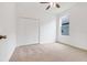 Spacious bedroom features large closet and ceiling fan for comfortable living at 251 Blue Cypress Dr, Groveland, FL 34736