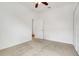 Carpeted bedroom with a ceiling fan and a closet with bi-fold doors at 251 Blue Cypress Dr, Groveland, FL 34736