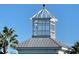 A close-up of the white gazebo roof with a bird perched on top at 251 Blue Cypress Dr, Groveland, FL 34736