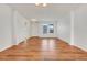 Bright and airy living room with wood flooring, neutral paint and large windows providing ample natural light at 251 Blue Cypress Dr, Groveland, FL 34736
