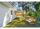 Backyard view showing covered patio and green lawn at 2517 Royal Palm Dr, Edgewater, FL 32141