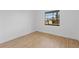 This empty bedroom is light and bright with laminate floors and a window at 2517 Royal Palm Dr, Edgewater, FL 32141